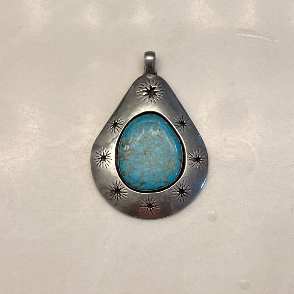 Silver and turquoise pendant.